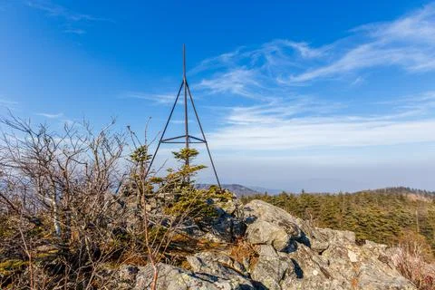 The triangular sign stands on a rocky ridge in the Primorsky Territory. Autum Stock Photos