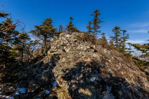 The triangular sign stands on a rocky ridge in the Primorsky Territory. Autum Stock Photos