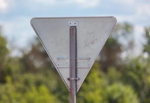 A triangular sign with a white arrow pointing to the right Stock Photos