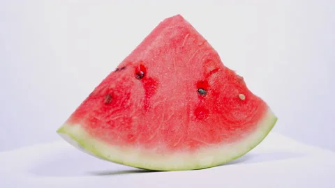 Triangular slice of watermelon. Organic juicy red watermelon healthy food Stock Footage 161778166