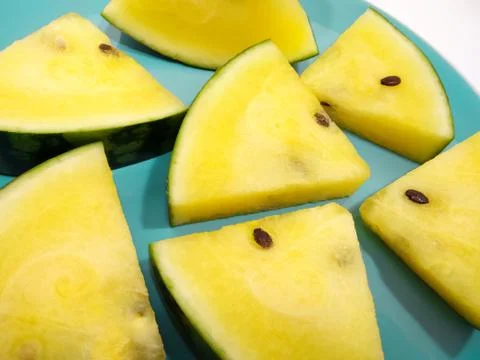 Triangular Slices of Yellow Watermelon Stock Photos
