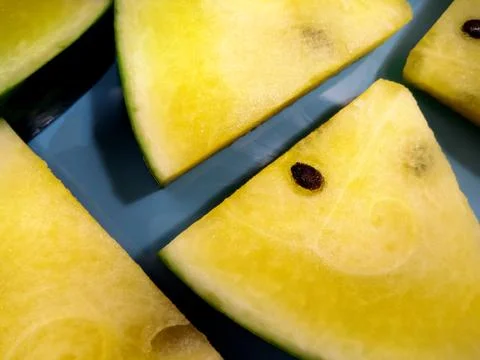 Triangular Slices of Yellow Watermelon Foto stock