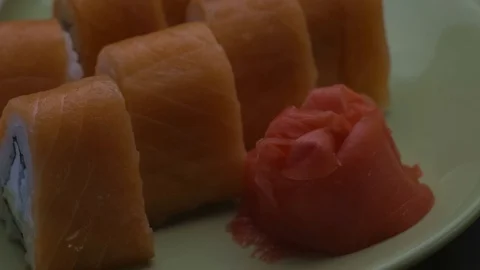 Triangular sushi rolls Philadelphia on a plate. Close-up Stock Footage 75035345