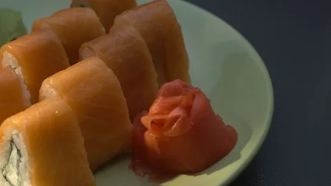 Triangular sushi rolls Philadelphia on a plate. Close-up Stock-Footage 75036430