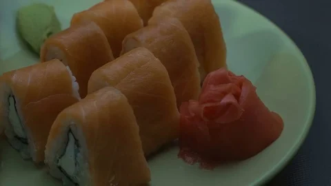 Triangular sushi rolls Philadelphia on a plate. Close-up Stock Footage 75185714
