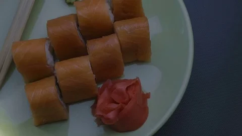 Triangular sushi rolls Philadelphia on a plate. Close-up Stock Footage