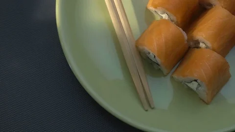 Triangular sushi rolls Philadelphia on a plate. Close-up. View from above Stock Footage 75187585