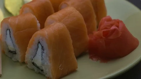 Triangular sushi rolls Philadelphia on a plate. Close-up Vídeo Stock 75203685