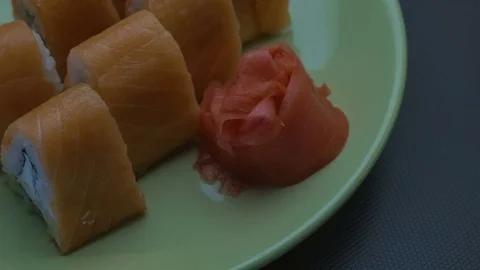Triangular sushi rolls Philadelphia on a plate. Close-up Stock Footage 75205643