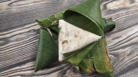 Triangular Tempeh Wrapped in Banana Leaves Video stock 329361791