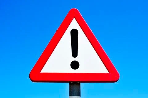 Triangular traffic sign with an exclamation mark 스톡 사진