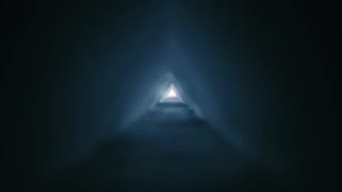 Triangular tunnel formed by bright light and waves of smoke extends in distance Stock Footage 313226628