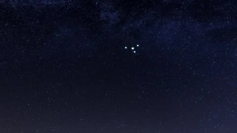 A triangular UFO flies over the ocean on a starry night. 3d render Stock Footage 295810932