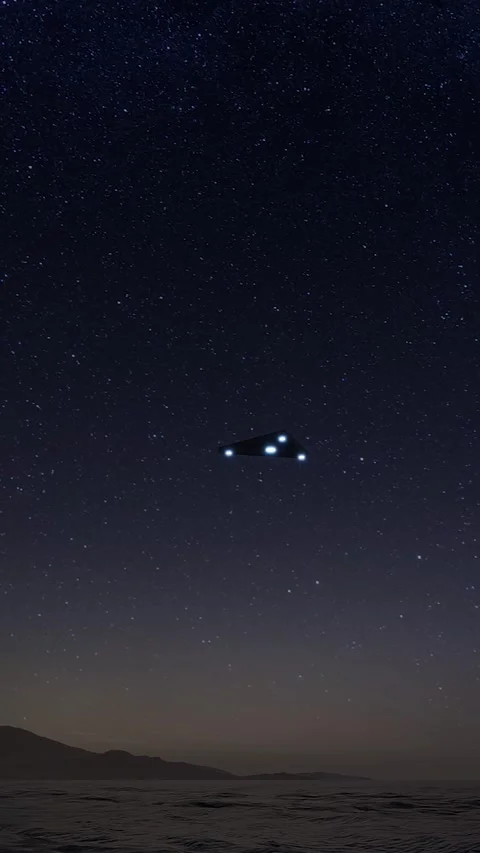 A triangular UFO flies over the ocean on a starry night. 3d render Stock Footage 295810967