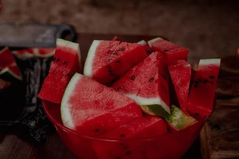 Triangular watermelon slices in a bowl on the table Stock Photos
