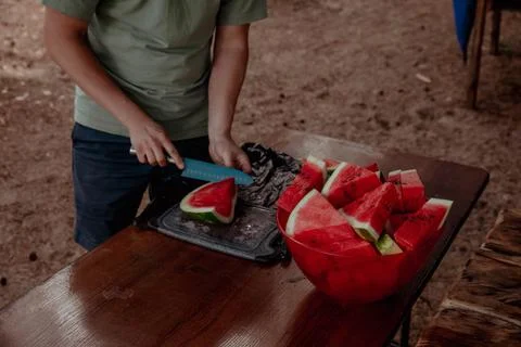 Triangular watermelon slices in a bowl on the table Stock Photos