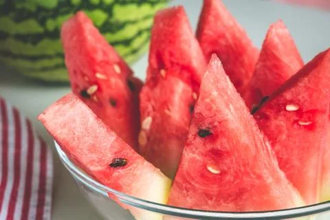 Triangular watermelon slices served on plate Stock Photos