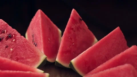 Triangular watermelon slices slowly rotate. Healthy food concept. Stock Footage 152314748