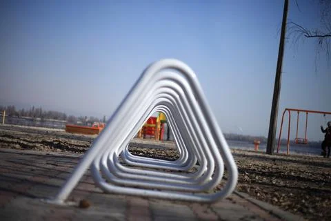 Triangular white iron spiral in the playground Stockfoto's