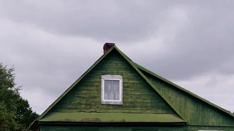 Triangular wooden gable roof of green painted vintage house in Daugavpils Stock Footage 344355225