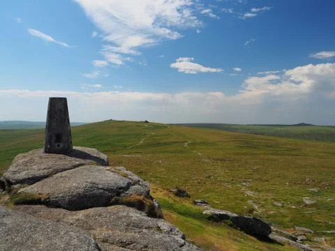 Triangulation pillar on Yes Tor looking to High Willhays with blue sky, Dartmoor Stock Photos