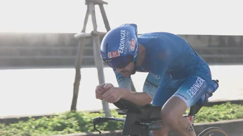 Triathlete drinking water while racing at IRONMAN 70.3 Vietnam in Danang in M Video stock 156317654