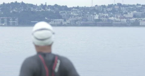 Triathlete warms up with Seattle background Stock Footage 40274141