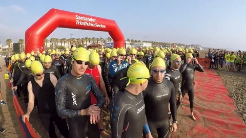 Triathletes get set for swim portion of a Triathlon in Valencia, Spain Stock Footage 89698245