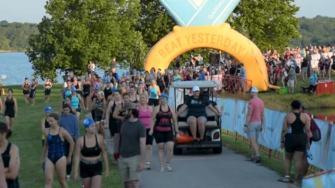 Triathletes make their way to the start Stock Footage 140935177