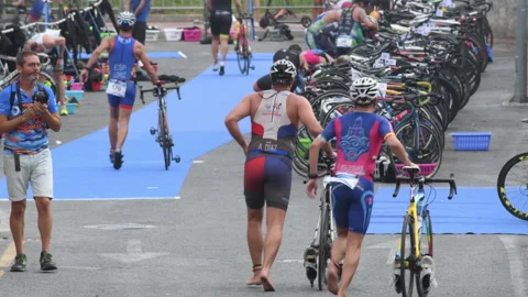 Triathletes in a transition phase in a Stock Video Pond5