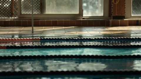 Triathlon female athlete training in swimming pool in slowmotion Stock Footage