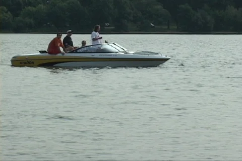 Triathlon group start running through frame to water Stock Footage 125449502