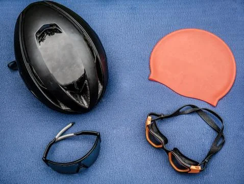 Triathlon items on blue background Stock Photos