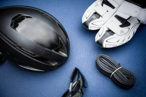 Triathlon items on blue background Stock Photos