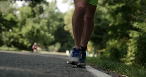 Triathlon Runner On Pavement - Slow Motion Stock Footage 170005358