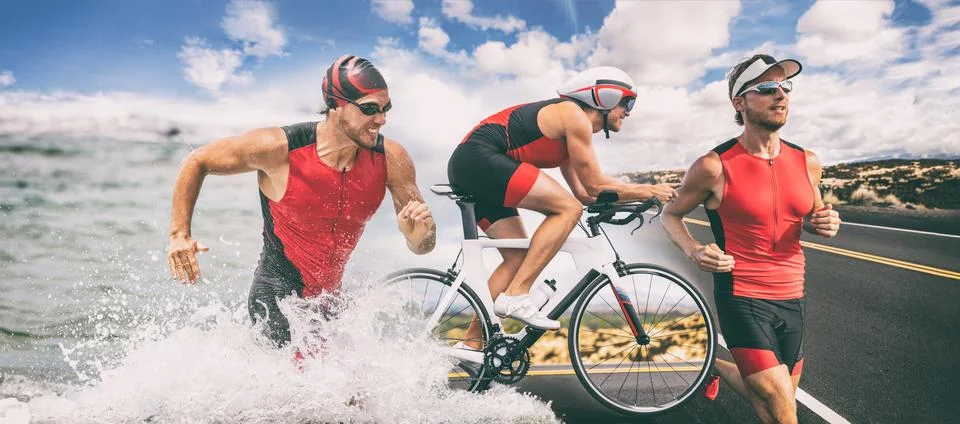 Triathlon swim bike run triathlete man running biking swimming in ocean at Stock Photos