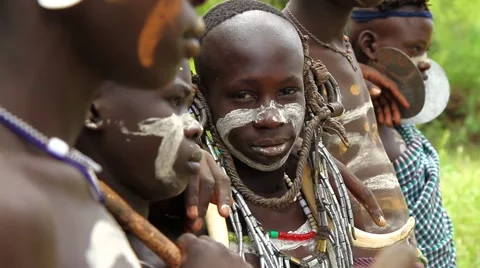 Tribal Group From The Omo Valley Posing With One Boy Looking at Camera Stock Footage 66355527