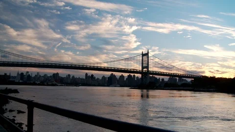Triborough/RFK Bridge with view of skyline and water, dusk. 스톡 동영상 106019643