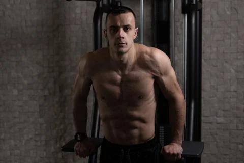 Triceps And Chest Exercise on Parallel Bars Stock Photos