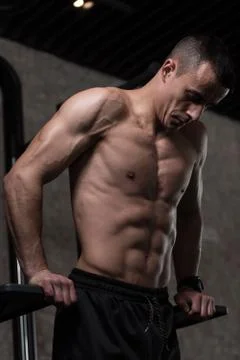 Triceps And Chest Exercise on Parallel Bars Stock Photos