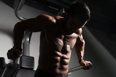 Triceps And Chest Exercise on Parallel Bars Stock Photos