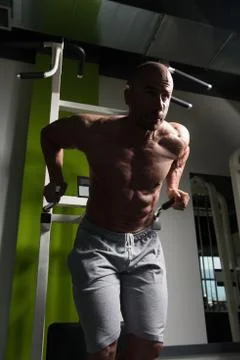 Triceps And Chest Exercise on Parallel Bars Stock Photos