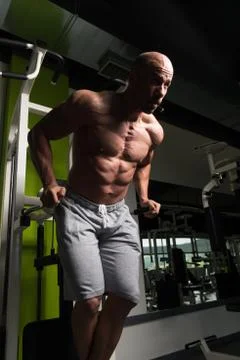 Triceps And Chest Exercise on Parallel Bars Stock Photos