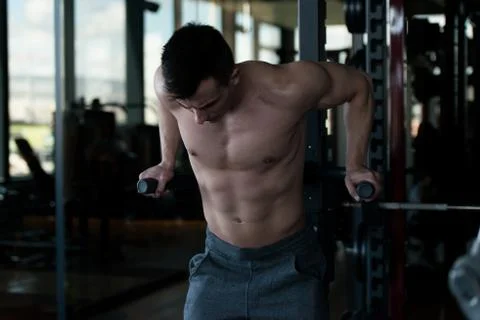 Triceps And Chest Exercise on Parallel Bars Stock Photos