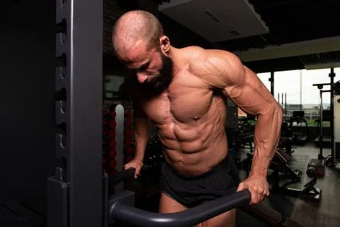 Triceps And Chest Exercise on Parallel Bars Stock Photos