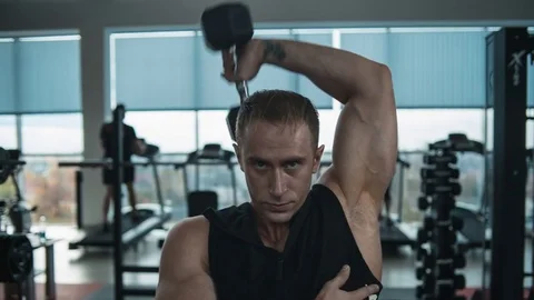 Triceps workout with dumbbell Stock Footage 82353461