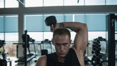 Triceps workout with dumbbell. Loop Stock Footage 82355316