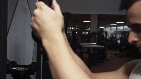 Triceps workout in gym machine Stock Footage 117910115