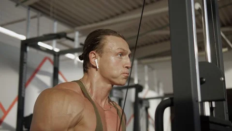 Triceps workout in gym machine Stock Footage 118074819