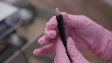 Trichologist preparing scalp mesotherapy dermapen for treatment Stock-Footage 346987943
